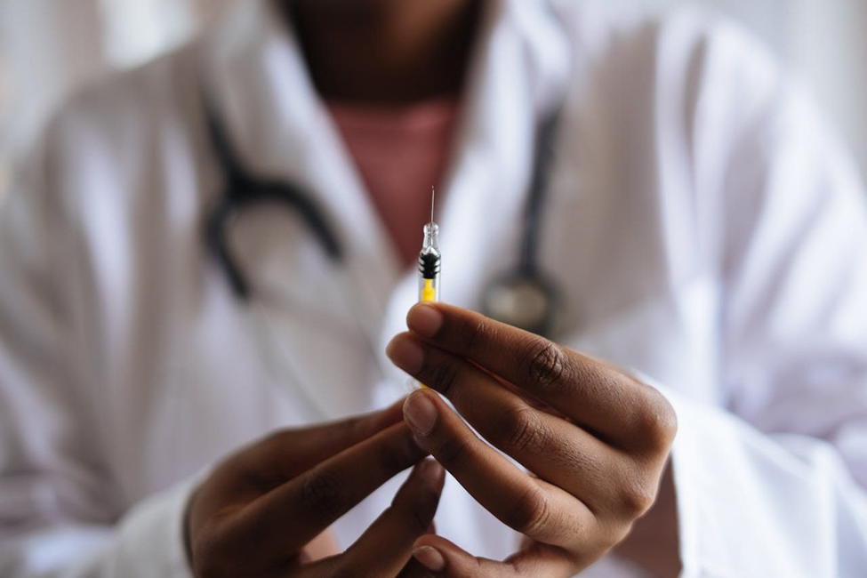 Doctor holding an injection